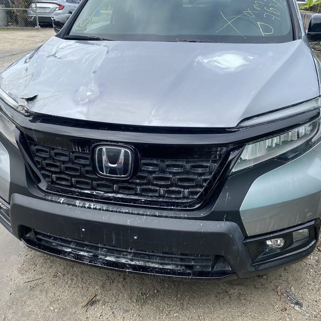 SUV with front-end collision damage